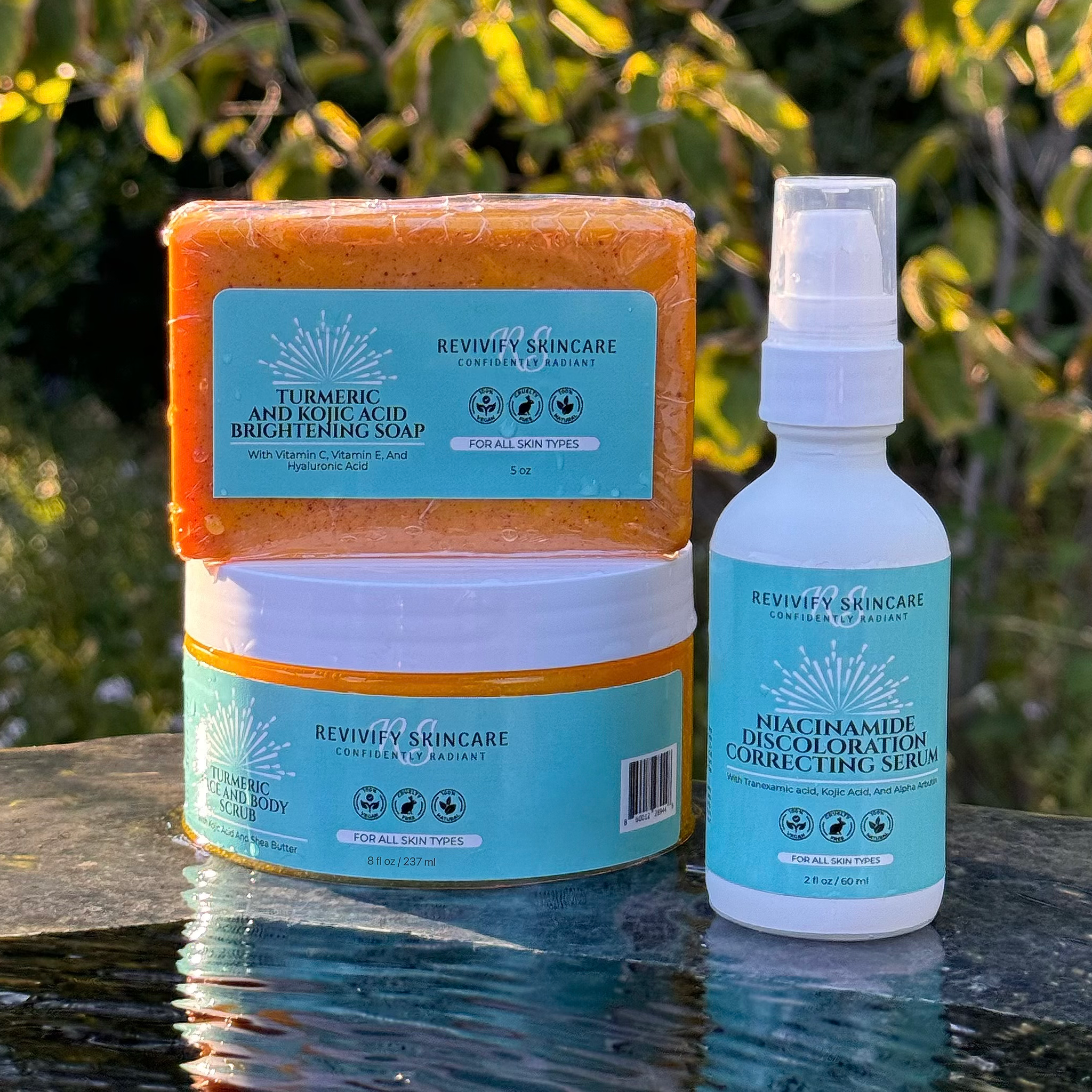 Kojic Bundle featuring turmeric soap, exfoliating scrub, and niacinamide serum for brighter, healthier skin.