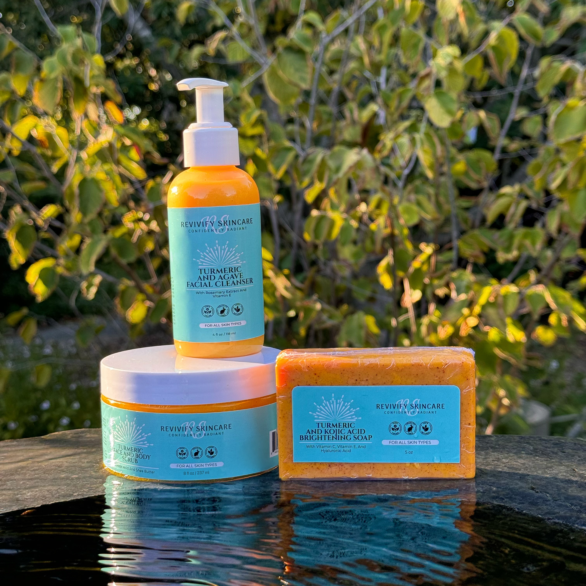 Turmeric skincare bundle with bar soap, cleanser, and scrub against a natural backdrop for glowing skin benefits.